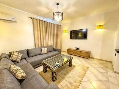 a living room with a couch and a coffee table at Apart 2-Bedrooms Centre of Marrakech-Medina place in Marrakech