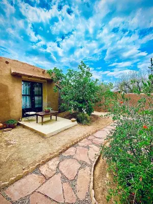 a house with a picnic table in a yard at Countryside House in Marrakech