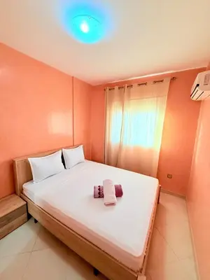 a bedroom with a large bed with a blue light at N9 Parfait Top Près De Gueliz in Marrakech