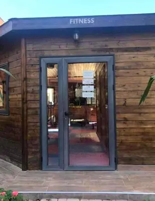 a entrance to a building with a glass door at Chez Mams Guest House - Private Rooms in a Resort-Style Apartment Complex in Marrakech