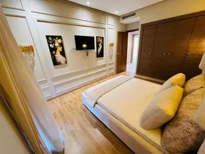 a bedroom with a large bed in a room at Perle garden in Marrakech