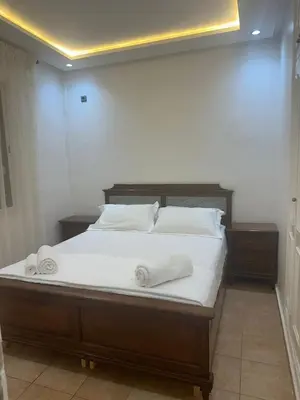 a bedroom with a bed with two towels on it at Cozy Stay Central Marrakech in Marrakech
