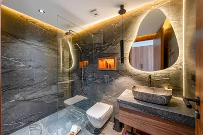 a bathroom with a sink and a toilet and a mirror at Villa Simone in Marrakech