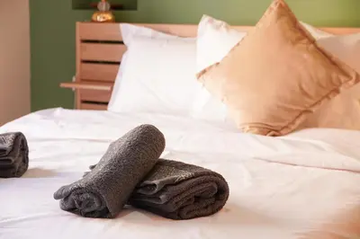 a pair of towels sitting on top of a bed at Modern 2 bedroom apartment, one with terrace in Marrakech
