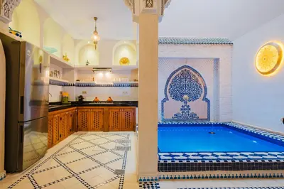 a kitchen with a swimming pool in a room at Riad Marrakech Dar Tivawin 3 rooms With Pool Private Riad in Marrakech