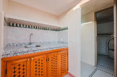 a bathroom with a sink and a walk in shower at Riad Marrakech Dar Tivawin 3 rooms With Pool Private Riad in Marrakech