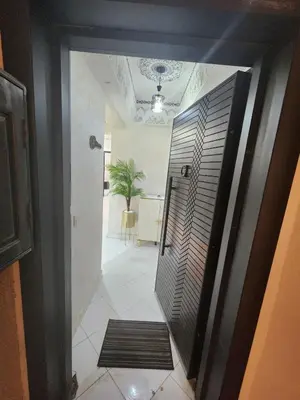 a hallway with a door leading into a room at 2 bedroom apartment, living room, kitchen in Marrakech in Marrakech