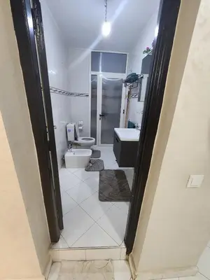 a bathroom with a toilet and a sink at 2 bedroom apartment, living room, kitchen in Marrakech in Marrakech