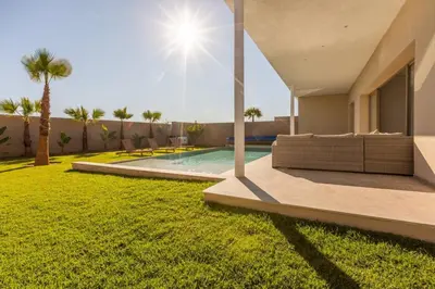 a house with a yard with a swimming pool at Villa Seyana 5 Zero vis a vis Piscine chauffee in Marrakech