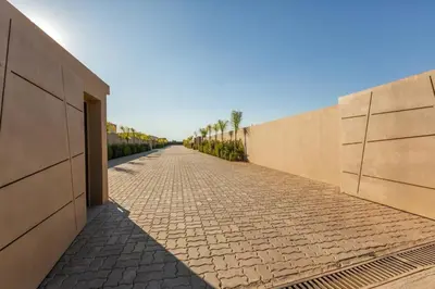 a brick sidewalk next to a wall at Villa Seyana 5 Zero vis a vis Piscine chauffee in Marrakech