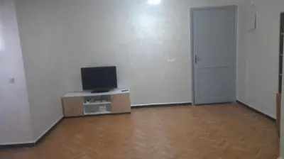 an empty room with a television and a door at Bahiya in Marrakech