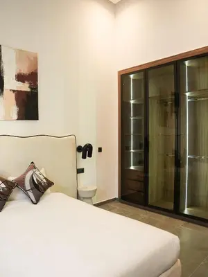 a bedroom with a bed and a sliding glass door at Villa Crystale - Marrakech in Marrakech