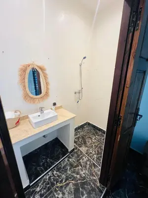 a bathroom with a sink and a mirror at Excellente Villa A Proximité De Marrakech in El Aïn