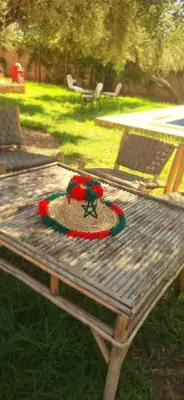 a wooden picnic table with a toy on top of it at Excellente Villa A Proximité De Marrakech in El Aïn