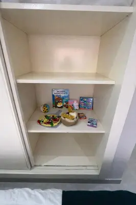 a shelf in a room with some food on it at Appartement spacieux centre ville quartier dynamique in Marrakech