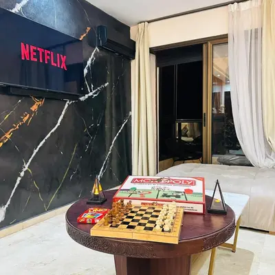 a chess board on a table in a hotel room at Chic Stay in Gueliz 2, Parking sur place, Netflix in Marrakech