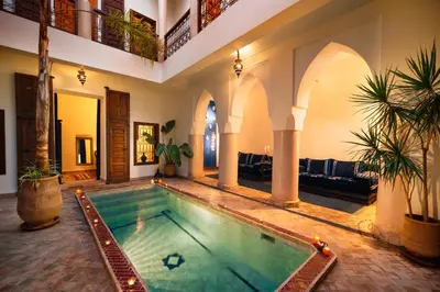 an indoor swimming pool in a house at Riad Darhani in Marrakech