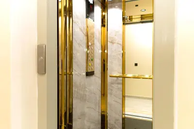 a dressing room with a glass door with a mirror at Menara Garden Cosy Appartement Hivernage Marrakech in Marrakech