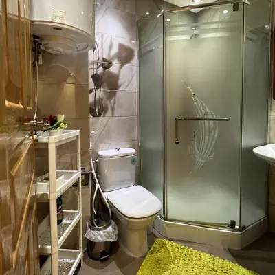 a bathroom with a toilet and a glass shower at Marrakech Family Stay City Center in Marrakech