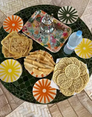 a table topped with plates of food on a table at Dar Mayleya in Marrakech