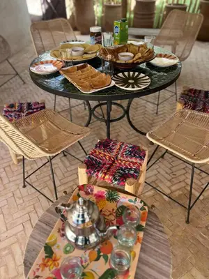 a table with plates of food on top of it at Dar Mayleya in Marrakech