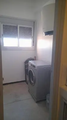 a washing machine in a room with a window at Bahia in Marrakech