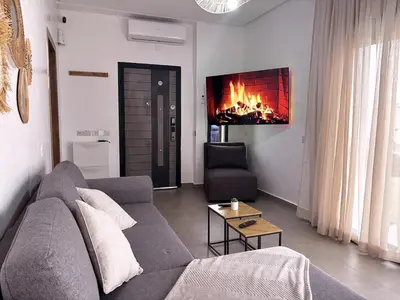 a living room with a couch and a fireplace at Villa Marrakech DAR JAHYR in Douar Ouled Ahmed