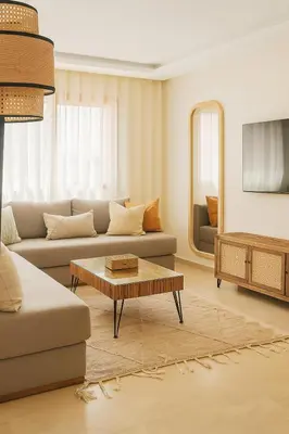 a living room with a couch and a table at Studio bien équipé au centre de gueliz gueliz in Marrakech