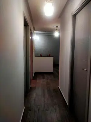 a hallway with a table in the middle of a room at 2-bedroom apartment in Marrakech