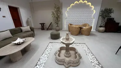 a living room with a couch and a table and chairs at Riad Dari and spa - 8 ROOMS EXCLUSIVITY in Marrakech