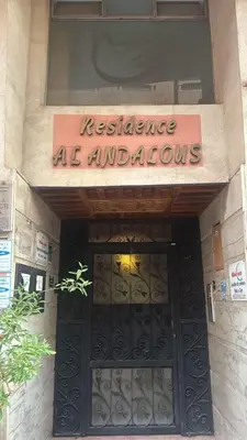 a sign over the door of a restaurant with a gate at Cozy apartment in the hypercenter in Marrakech