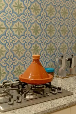 an orange object sitting on top of a stove at Riad Dar Moulay 120m2 in der Medina mit Terrasse in Marrakech