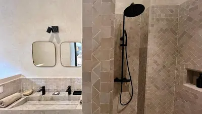 a bathroom with a shower and a sink at Riad Bergamot in Marrakech