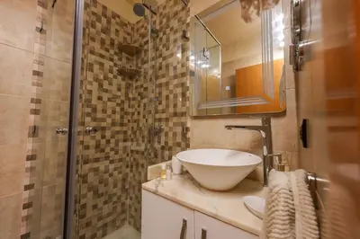 a bathroom with a sink and a shower at NS 51 by KMREI Properties in Marrakech