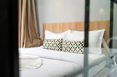 a bed with two pillows on top of it at Luxurious apartment ,hot tub in Marrakech