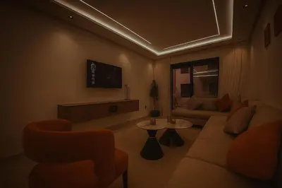 a living room with a couch and a tv at Stylish Hivernage Studio in Marrakech