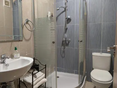 a bathroom with a shower and a toilet and a sink at Le Cocon Nature in Marrakech