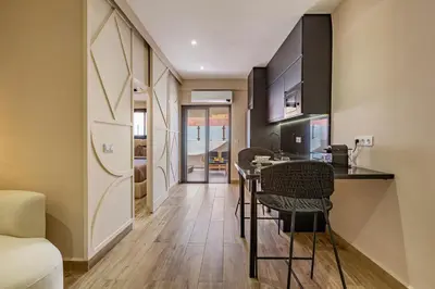 a kitchen and dining room with a table and chairs at NOUVEAU à Marrakech in Marrakech