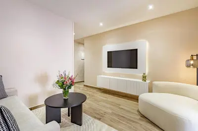 a living room with a couch and a tv at NOUVEAU à Marrakech in Marrakech
