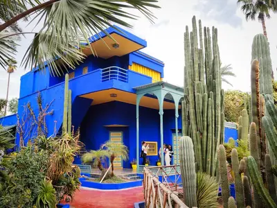 a blue house with cacti in front of it at Studio cosy avec piscine et balcon Résidence Mirador Majorelle in Marrakech