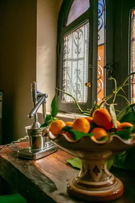 a bowl of fruit sitting on a bathroom sink at DAR MA ITTO Charming luxurious Medina Cocoon in Marrakech