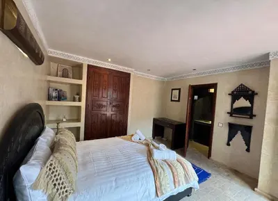 a bedroom with a large bed in a room at Échappée onirique au cœur de Marrakech in Marrakech