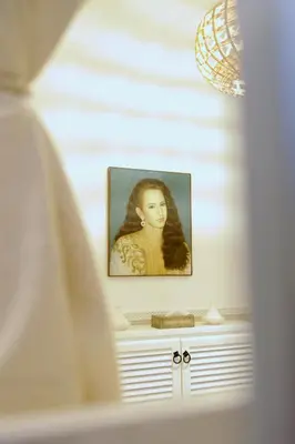 a framed picture of a woman on a wall at Riad KITSCH in Marrakech