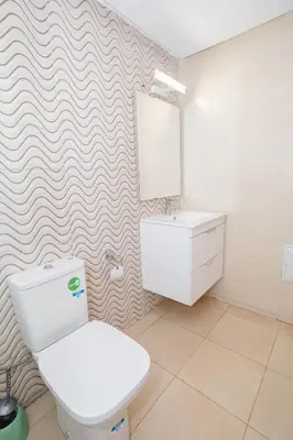 a bathroom with a toilet and a sink at Bonheur appartement in Marrakech