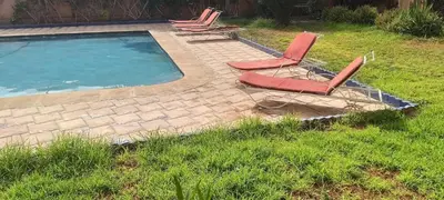 a group of chairs sitting next to a swimming pool at premium village m231 in Marrakech