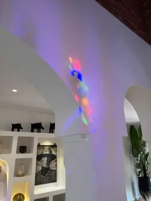 a person in a room with lights on a wall at Villa ÈME in Marrakech