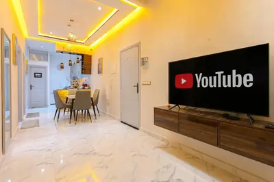 a television on a wall in a living room at Appartement limoen in Marrakech