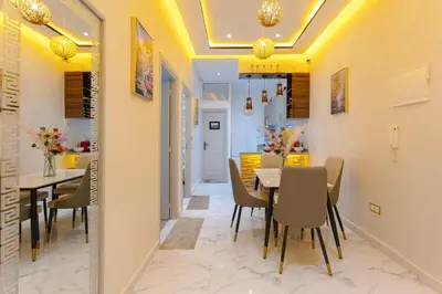a dining room with a table and chairs at Appartement limoen in Marrakech