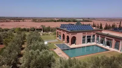 an aerial view of a house with a swimming pool at Villa de Charme avec Piscine, Hammam & Jardin Enchanté in Marrakech