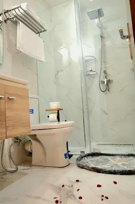 a bathroom with a toilet and a glass shower at Medali in Lahebichate